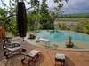 Amara Selous - pool with loungers